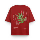 Red t-shirt with abstract design and 'Surcasm' branding on a white background