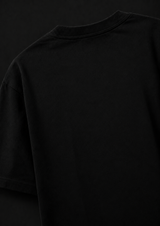 Black t-shirt against a black background