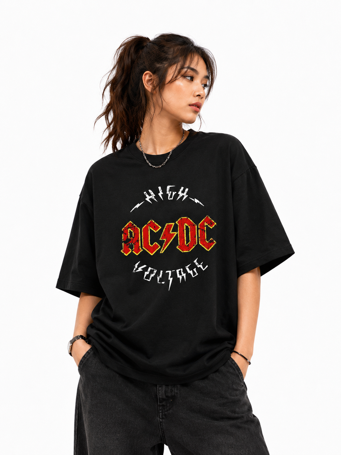 Person wearing a black t-shirt with AC/DC logo and text