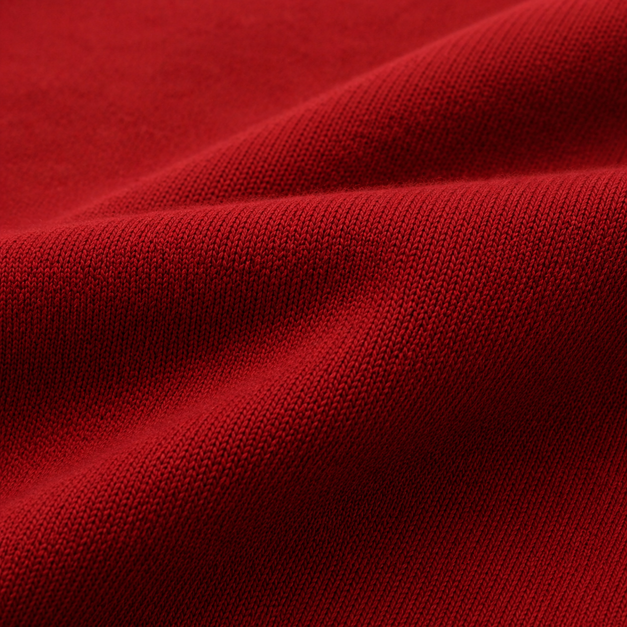Close-up of red fabric with a textured surface